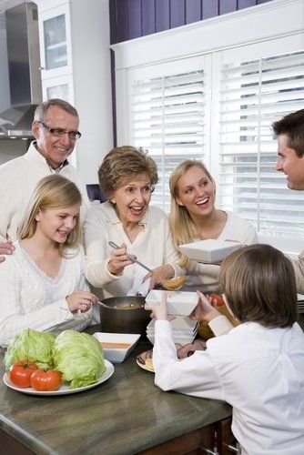 family gathering in a kitchen for a meal
