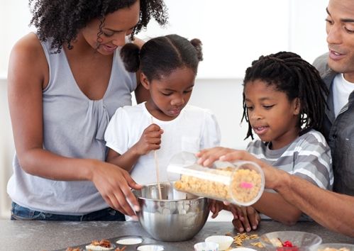 Family cooking together in a kitchen