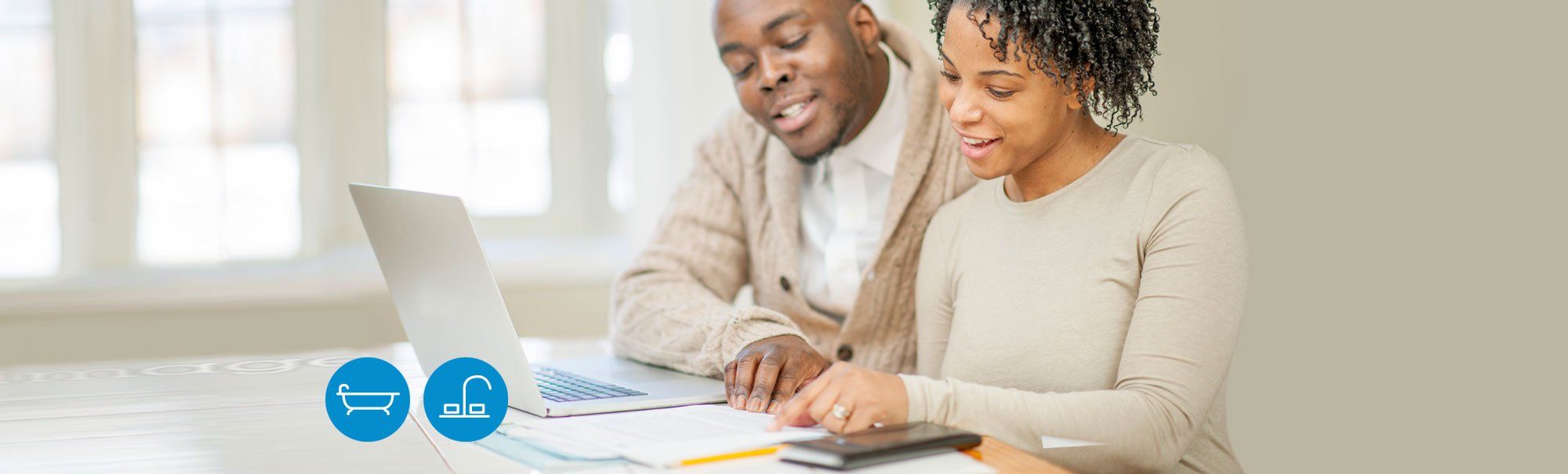 Couple using laptop for budget planning